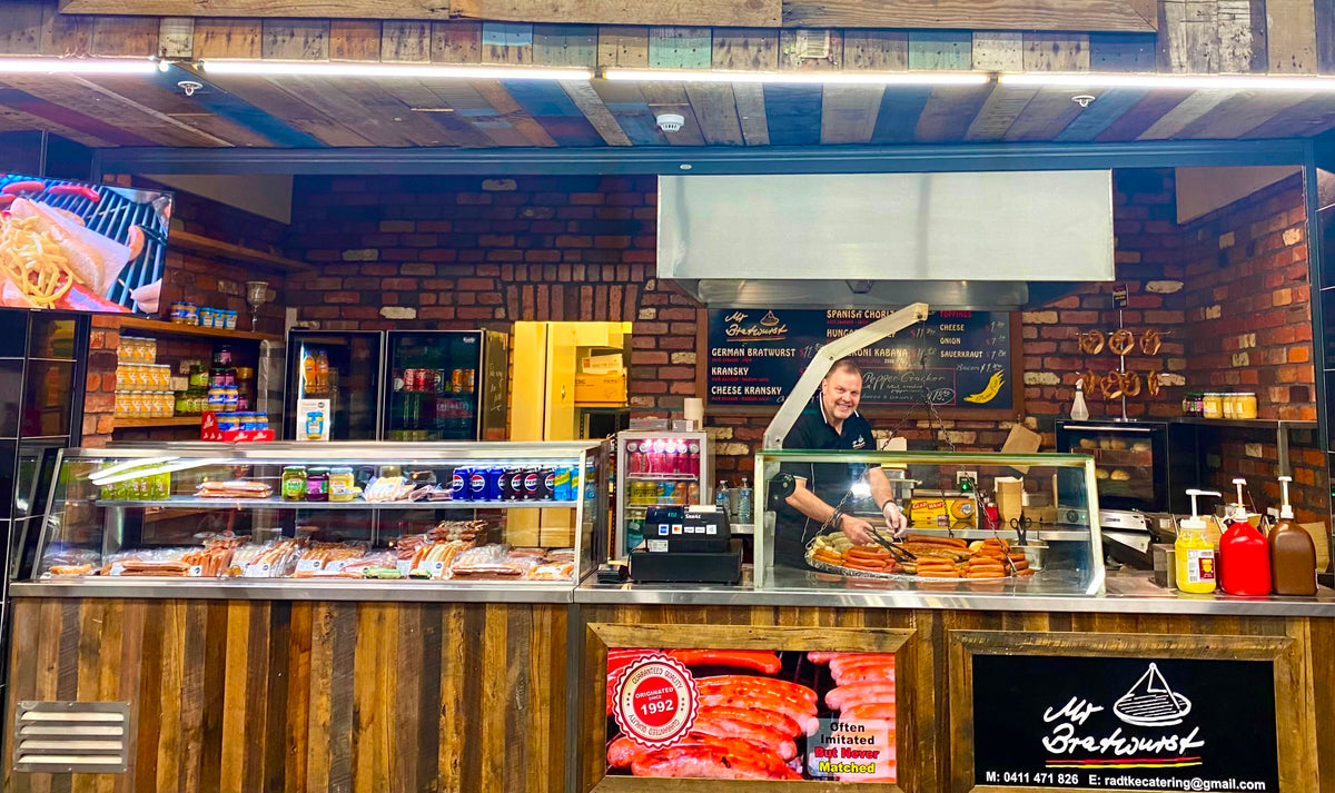 The Mr Bratwurst shop counter and charcoal grill at Prahran Market